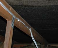 Speaker Cable Tacked to roof joist